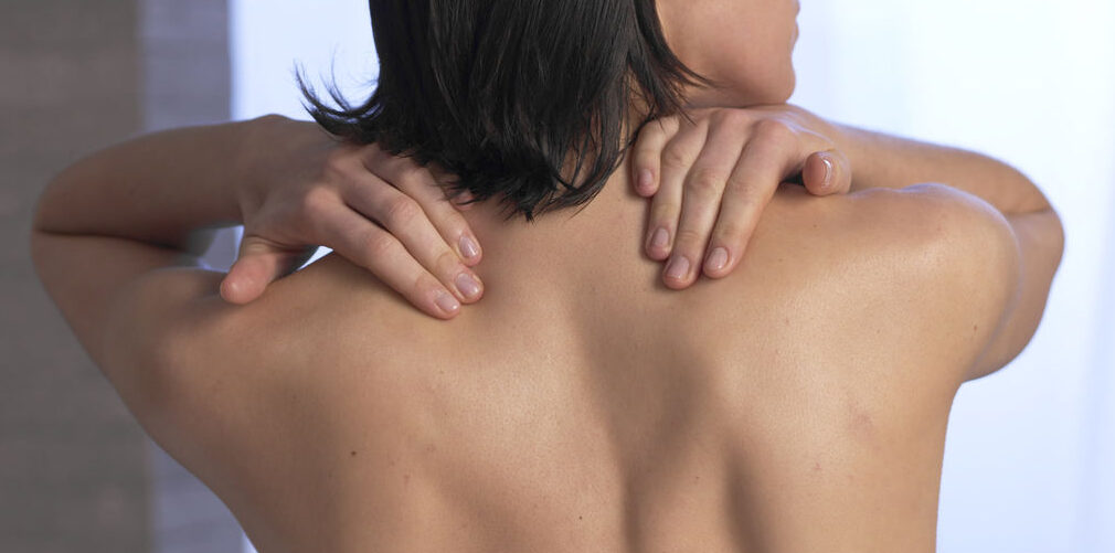 Woman with Hands on her Bare Back